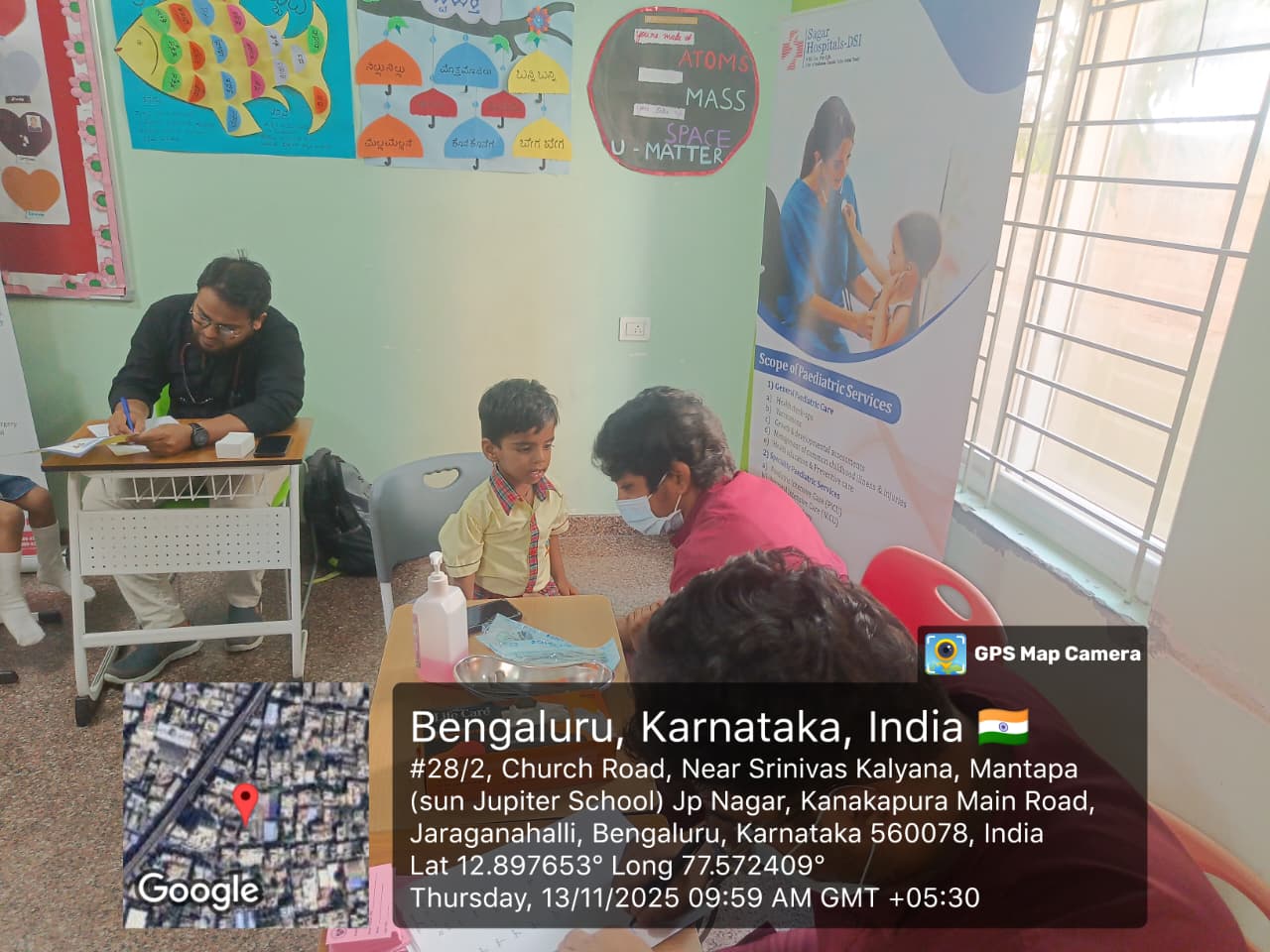 Dentist examining a child during the oral cancer screening camp